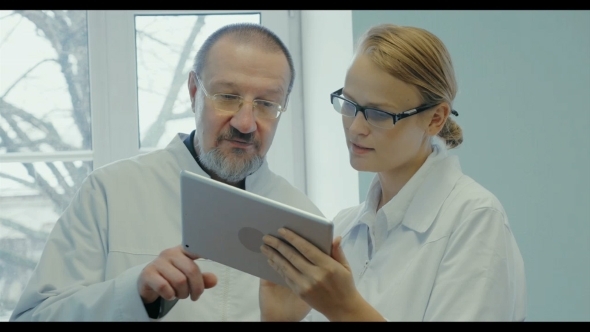 Two Doctors Having Professional Talk alt