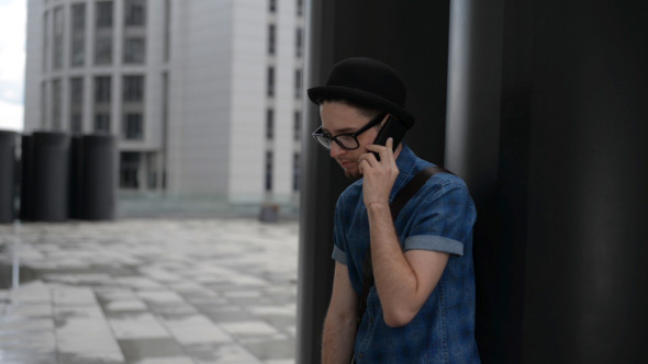 Young Man Talking on Phone