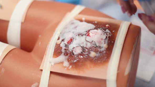 Medical Students Learn to Treat a Burn on a Mannequin