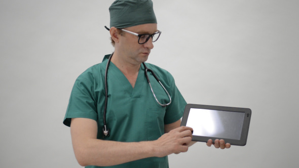 Doctor Showing Detail on Tablet