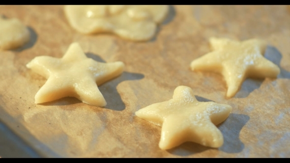 Woman Hand Placing Cookie Dough On Baking Tray alt