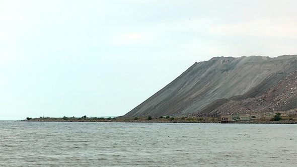 Mountain of Metallurgical Wastes on the Beach