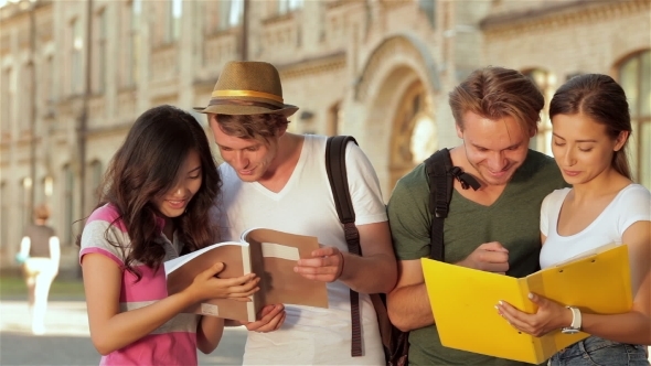 Cheerful Sudents Next To University alt