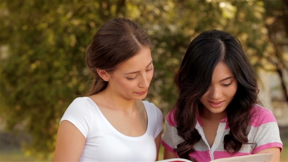 Two Beautiful Girls Studying Outdoors alt
