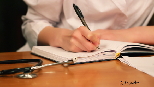 Doctor Writing The Note
