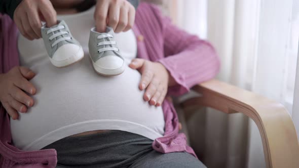 Pregnant Couple Feels Love and Relax at Home