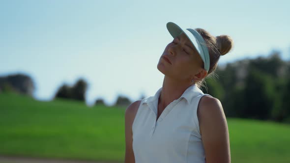 Sexy Golf Player Stretching at Course