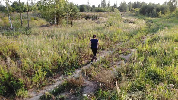 Woman running outdoors aerial shot