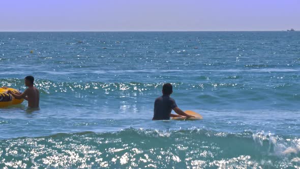 Guy Beginner Goes Into Ocean Holds Board Waits Wave