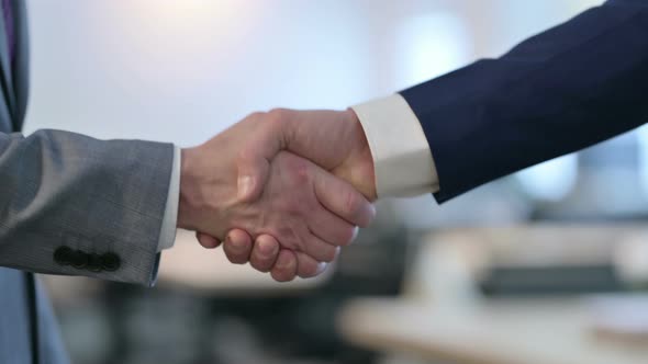 Close Up of Hand Shake Gesture By Two Businessmen