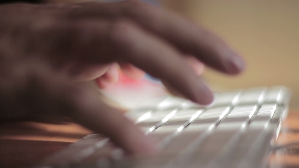 Hands Typing On The Remote Wireless Computer