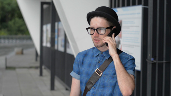 Young Man Talking on Phone 