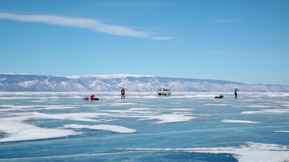 People Travel on Frozen Lake Baikal 3354