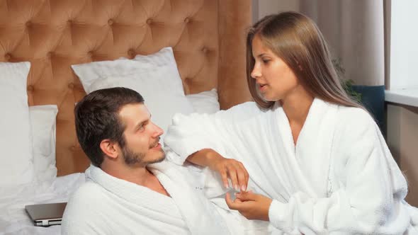 Beautiful Couple Relaxing Together in Bed, Wearing Bathrobes 1080p