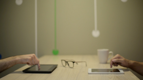 Hands Using Tablet PC at Night alt