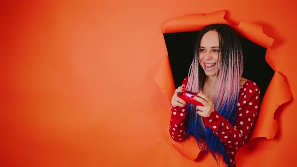 Smiling Woman with Gamepad and Playing Video Game