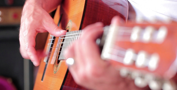 Man Playing Acoustic Guitar