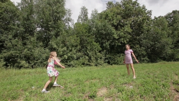 Two Girls Playing With The Ball