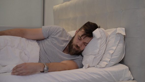 Man Disturbed while Sleeping