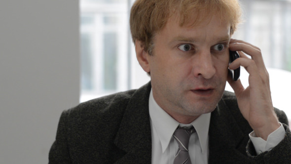 Angry Businessman on Phone alt