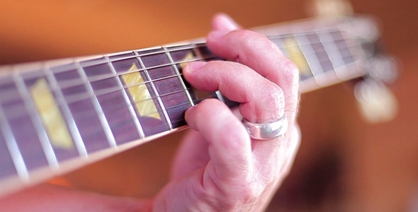 Fingers Playing Electric Guitar