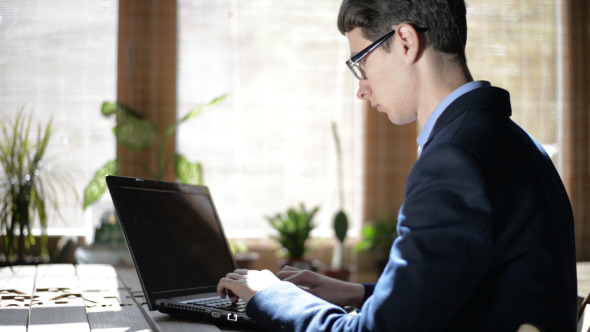 Young Freelancer Working on Laptop