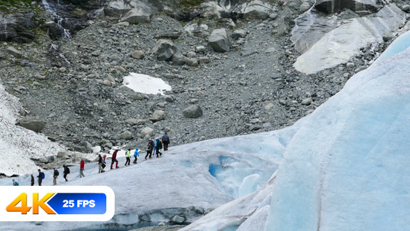 People Hiking Over Glacier