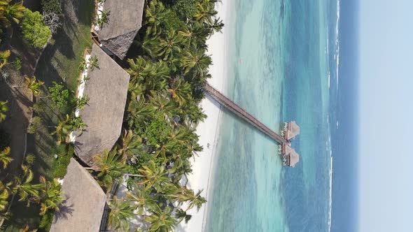 Vertical Video House on Stilts in the Ocean on the Coast of Zanzibar Tanzania Aerial View