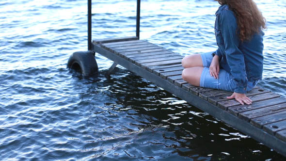 Girl on the Sea Sitting on the Pier alt