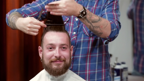 Beard Barber Making Haircut To Hipster Client alt