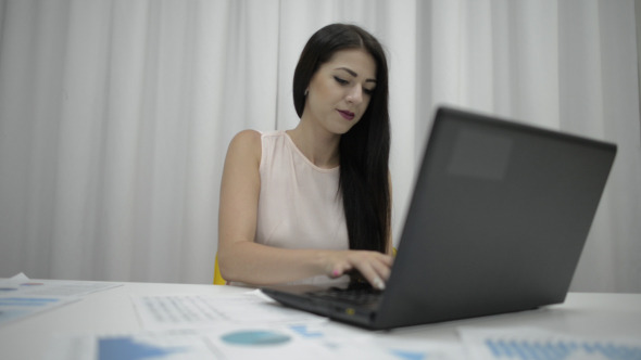 Working Girl Typing on Laptop Keyboard