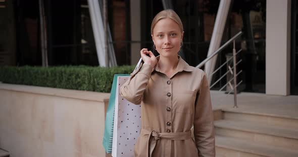 Portrait of Young Blonde Hair Girl Looking To Camera and Smiling, Attractive Stylish Woman Putting