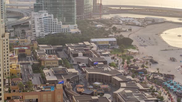 Waterfront Overview Jumeirah Beach Residence JBR Skyline Aerial Timelapse with Yacht and Boats