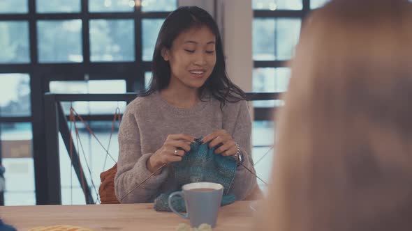 Knitting young woman