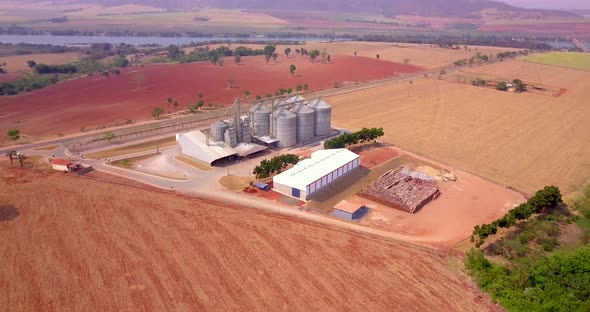 Aerial view of agricultural silos near the highway. Aerial drone image.