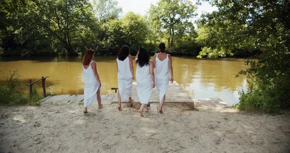 Four Girls Go To The River In White Transparent Dresses 