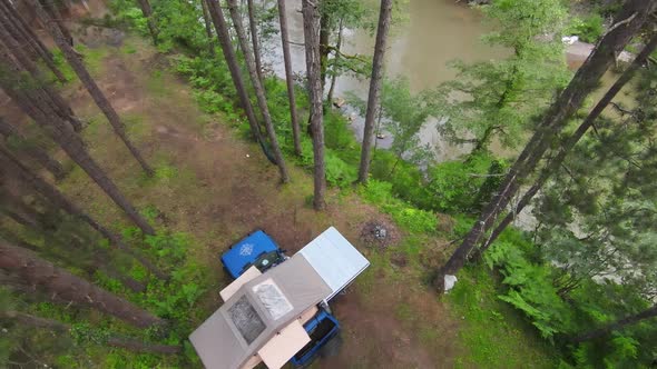 Top View of a Car Roof Toptent for Camping on the Roof Rack of an Offroad Car in a Forest on a Misty