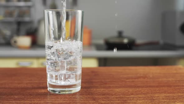 Pure Water is Poured into Transparent Glass