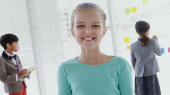 Kids as business executives smiling and working 4k