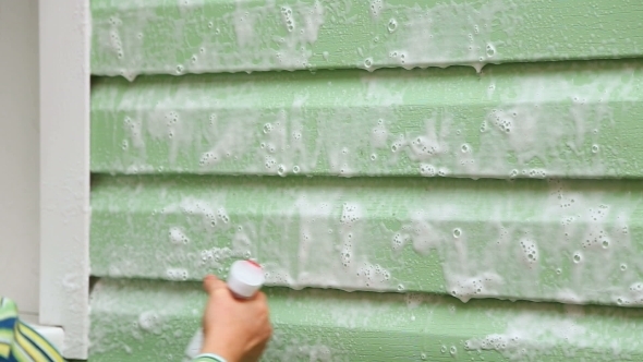 Woman Washing House Walls