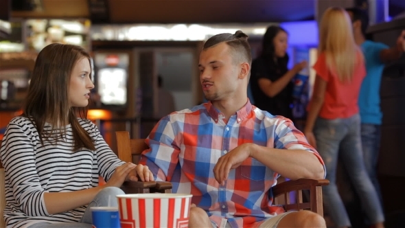 Two Friends Sharing Impressions About The Film alt