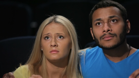 Young Couple Watching Movie alt