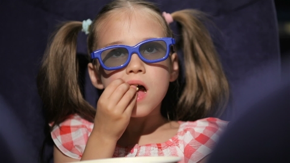 Beautiful Little Girl Waching Movie In The Cinema alt