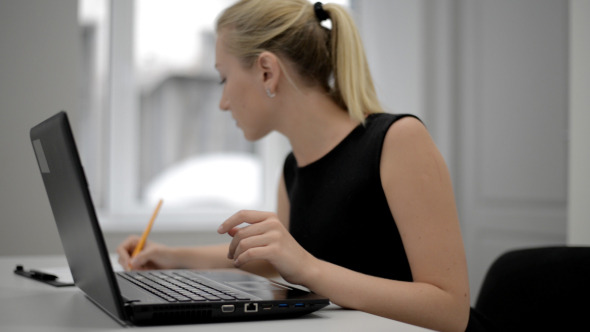 Office Girl Typing on Laptop Keyboard