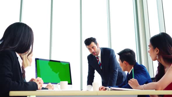 Business People in the Conference Room with Green Screen