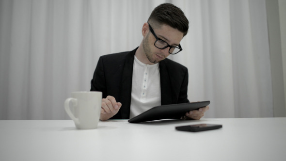 Man Using Tablet alt