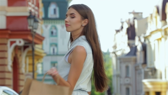 Beautiful Girl Walks Down The Street  alt