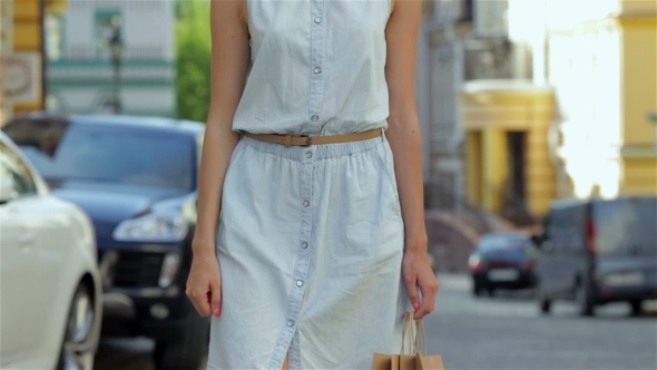 Beautiful Girl Walks Down The Street  alt