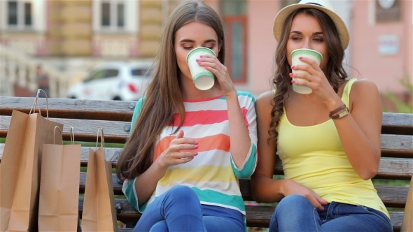 Two Girls On a Bench Drinking Coffee alt