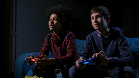 Smiling Teenagers Playing Video Games at Home